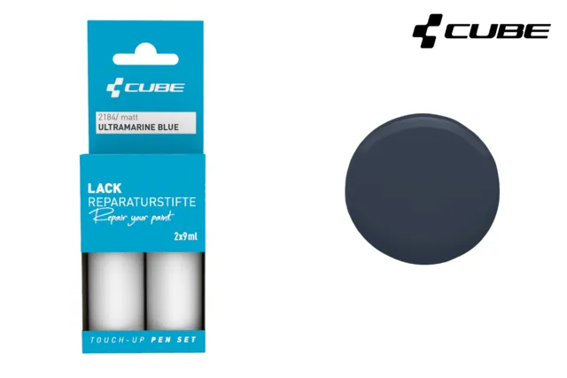 Das CUBE Lackstift Set ULTRAMARINE BLUE matt 2184 besteht aus zwei 12ml Lackstiften in blauer Verpackung, die neben einem kreisförmigen Farbmuster in Ultramarinblau abgebildet sind.